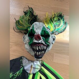 Scary clown costume with mask, kids size medium.